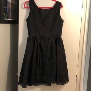 Formal high neck and lower back dress.